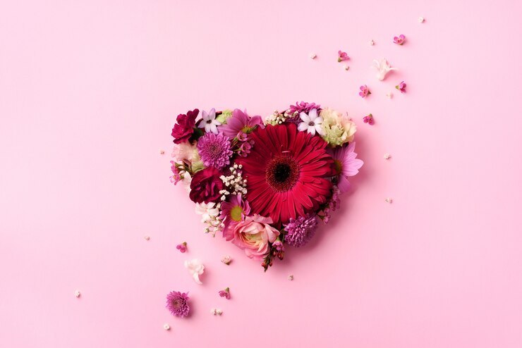 Photo heart shape made of spring flowers. 