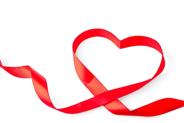 Photo heart shape of red ribbon isolated on white