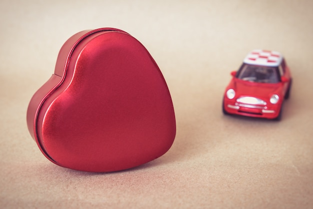 Photo heart shape with red car ,valentines day concept