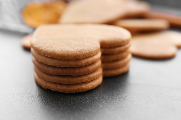 Heart shaped biscuits on grey table, closeup