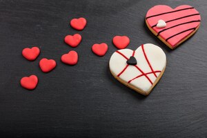 写真 heart shaped biscuits on a black background