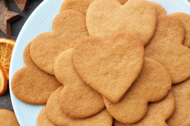 Heart shaped biscuits on plate, top view