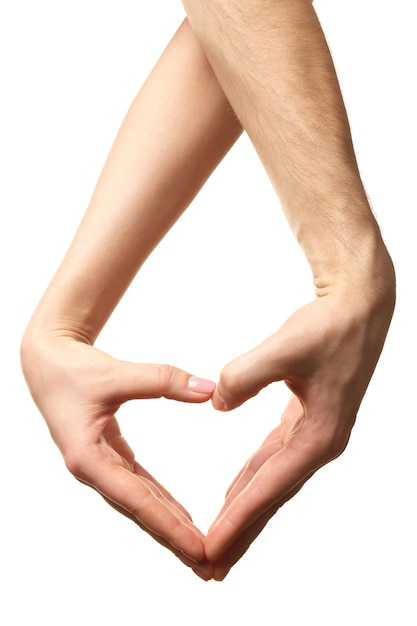 Heart shaped by male and female hands isolated on white