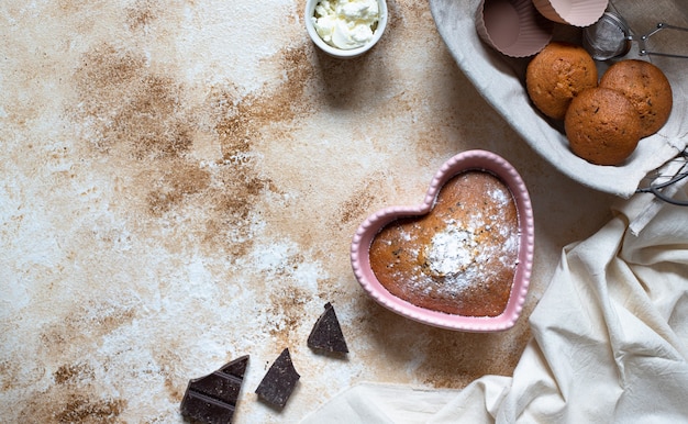 Heart-shaped cake in a pink baking dish