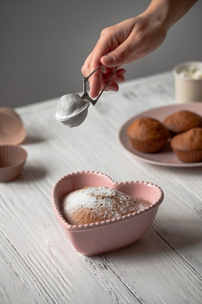 Heart-shaped cake in a pink baking dish