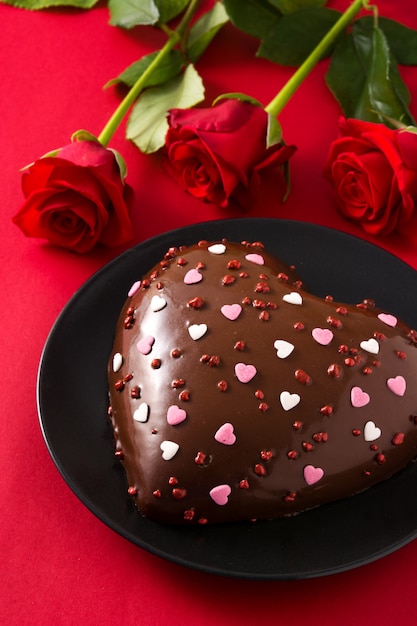 Heart shaped cake and red rose for Valentine's Day