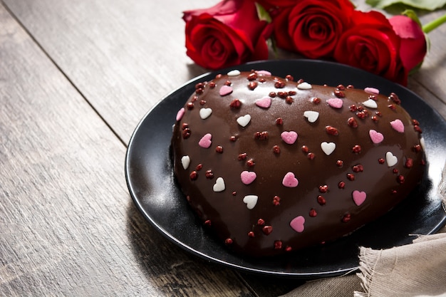 Heart shaped cake and red roses