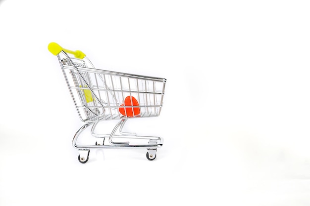 Heart shaped candy inside a shopping trolley