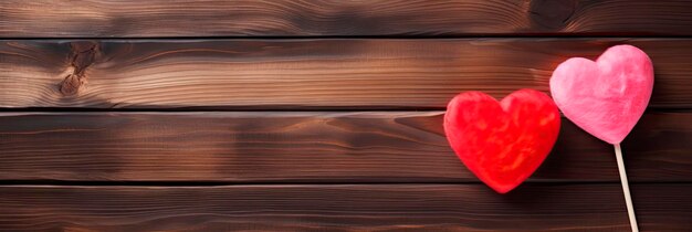 Heart shaped candy lollipop for valentines day on a wooden table