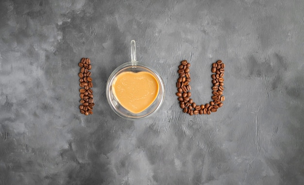 A heart shaped container with coffee beans and coffee beans.