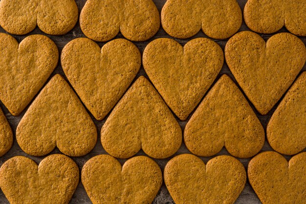 Heart shaped cookie pattern on wooden table