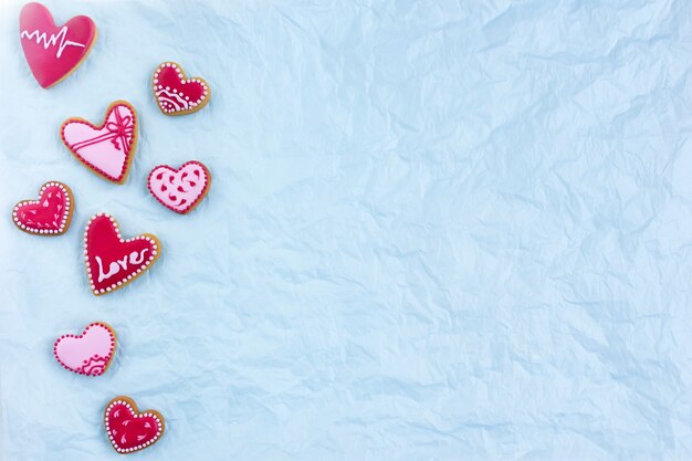 Heart shaped cookies flat lay for Valentine's day with love sign. High quality photo