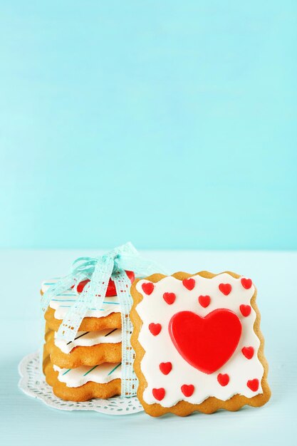 Heart shaped cookies for valentines day on color wooden background