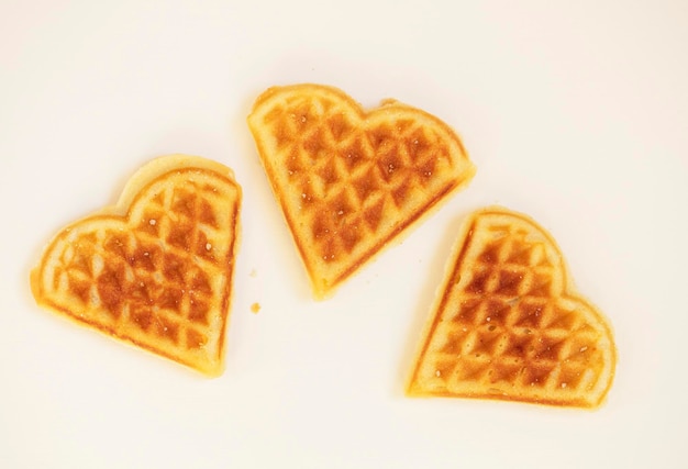 Heart shaped cookies Viennese waffles on a white background