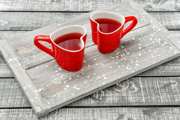 Heart shaped cups red tea Valentines day flat lay