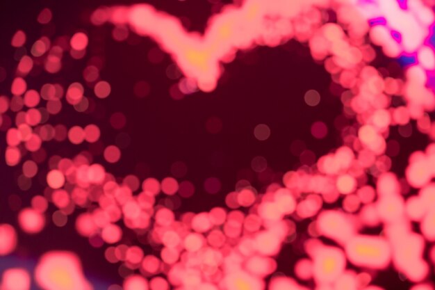 Heart shaped of disfocus of pink LED background