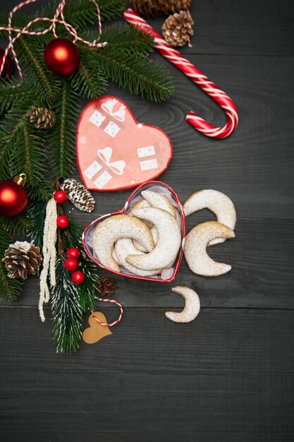 Heart shaped gift box full of traditional german or austrian vanillekipferl vanilla kipferl cookies