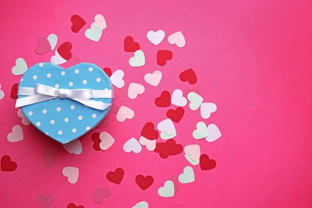 Heart shaped gift box on pink background