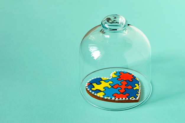 Heart shaped gingerbread with pattern of puzzles Concept of autism