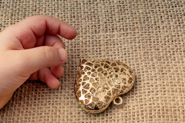 Heart shaped gold color metal object