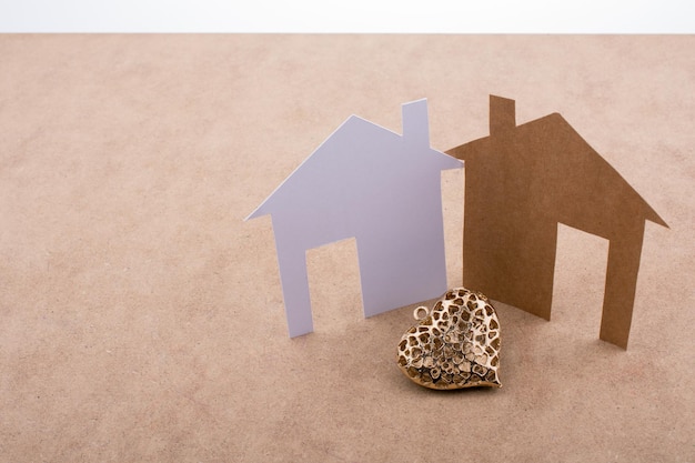 Heart shaped icon and paper houses