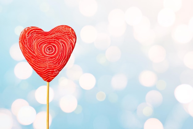 Photo heart shaped lollipop on defocus bokeh background