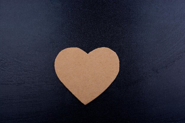 Heart shaped object on black background