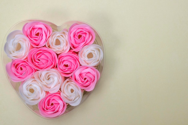 Heart Shaped Pink and white Rose Arrangement on a yellow Background Valentine Day