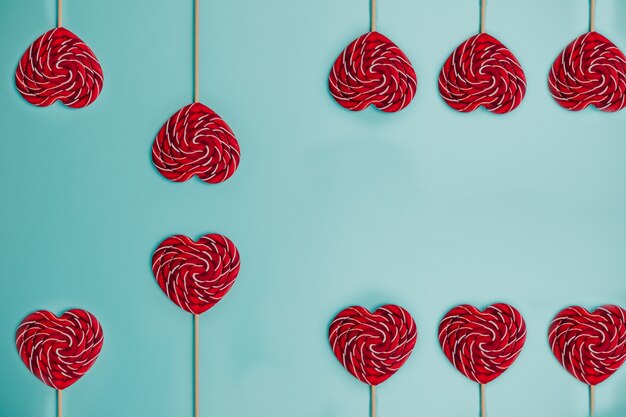 Heart shaped red lollipop. Colorful lollipop.