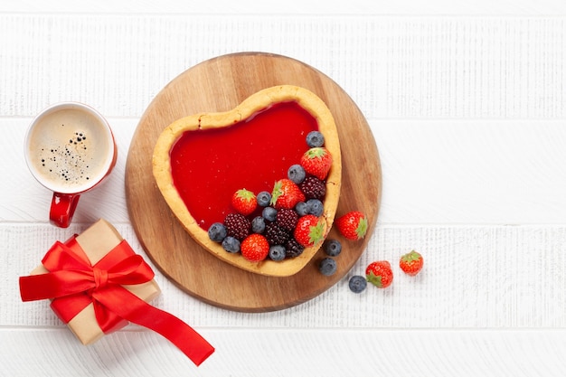 Heart shaped sweet cake with berries