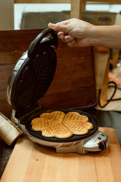 heart shaped waffles on a wooden plate