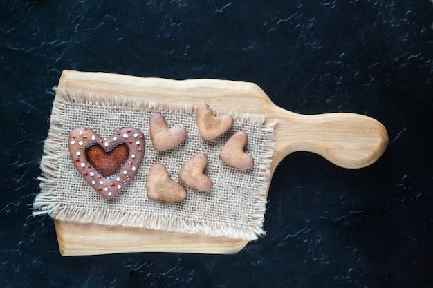 Photo heart shapep cookies on cutting board