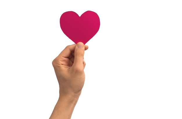 Heart speech bubble in male hand isolated on a white background photo