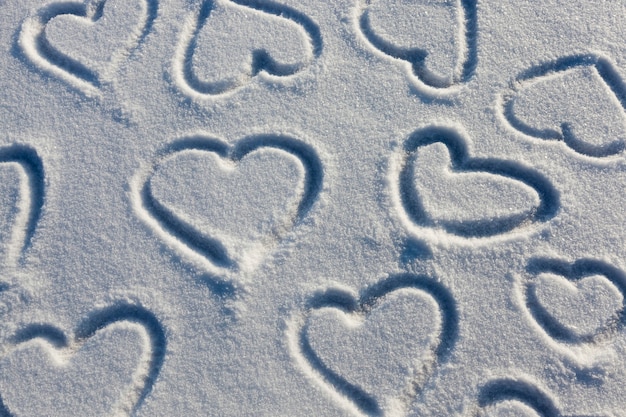 A heart symbol drawn on snow