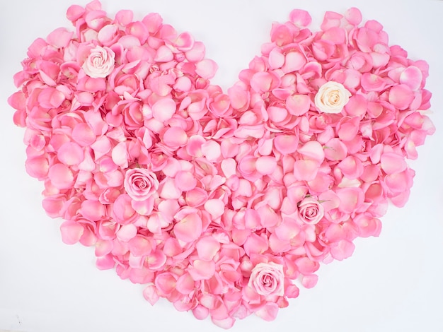 Heart symbol made of pink rose petals