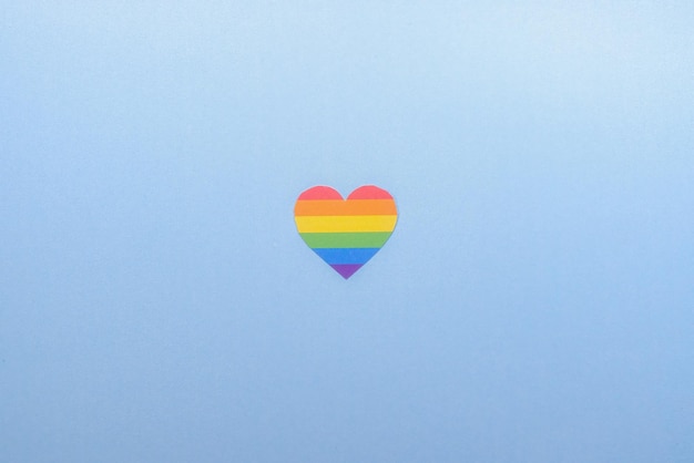 Heart with gay lgbt colors on blue background