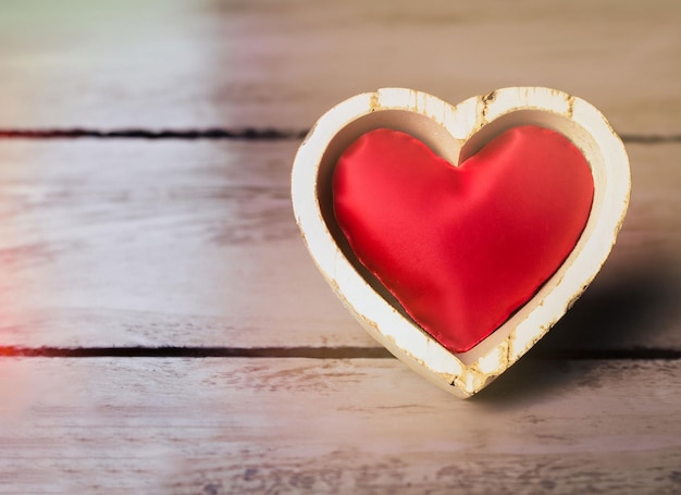 heart within heart for valentine day on wooden background