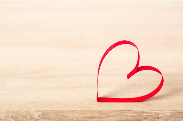 Heart on a wooden background. Valentine's Day concept. Banner.