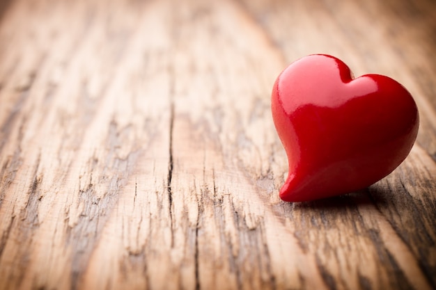 Heart on a wooden surface. Vintage style.