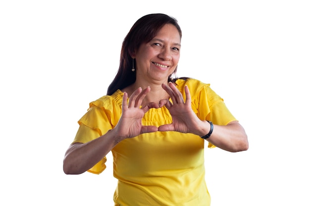 Heartfelt Smile Mature Latina Woman Forms Heart with Hands