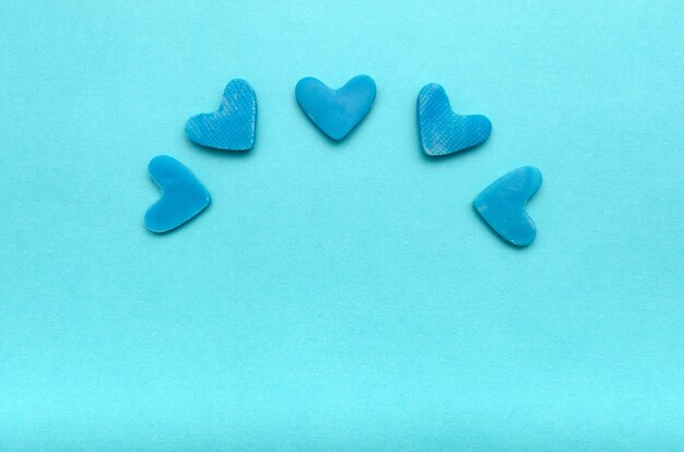 Hearts on blue background. Background for Valentine's Day.