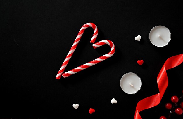 Hearts and candles on a dark background The concept of celebrating Valentine's Day Mother's Day