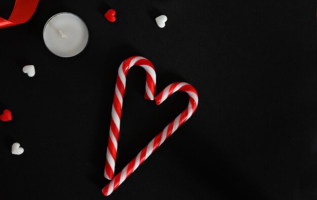 Hearts and candles on a dark background The concept of celebrating Valentine's Day Mother's Day