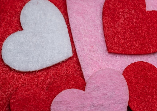 Photo hearts of different colors on the table.