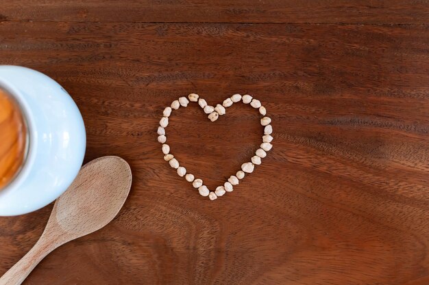 Heartshaped chickpeas on wooden background for valentine