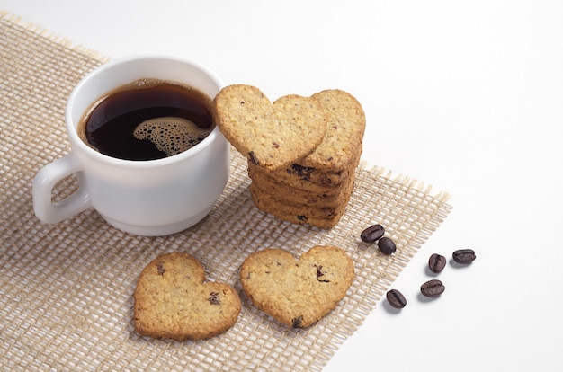 Heartshaped homemade cookies and a cup of coffee