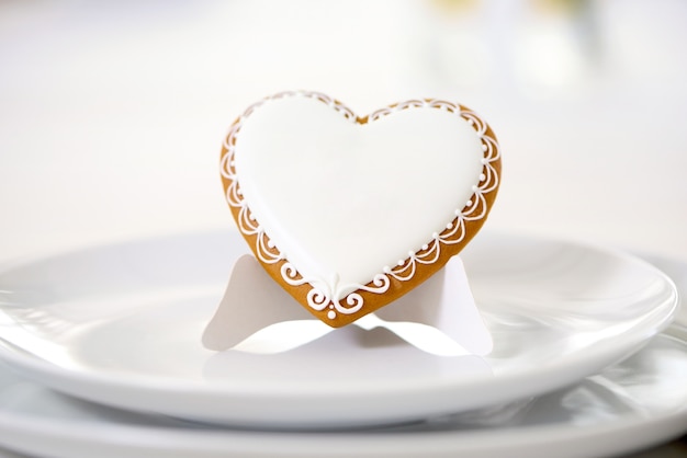 Heat-shaped cookie covered with white glaze