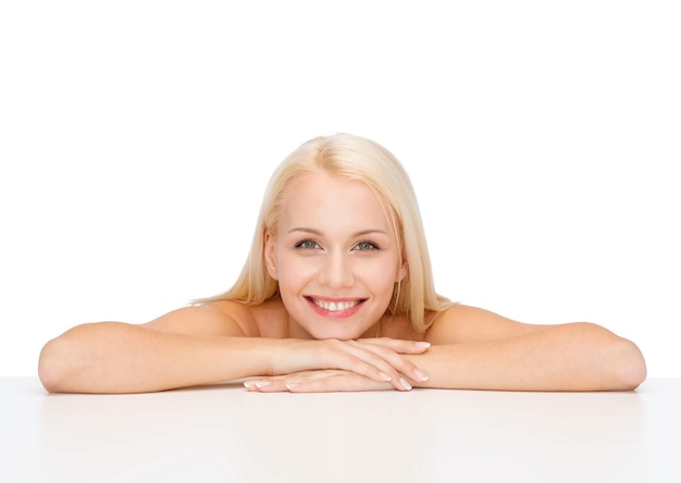 heath and beauty concept - closeup of clean face and shoulders of beautiful young woman