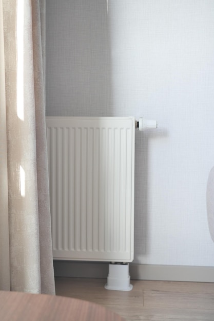 Heating radiator under window in the room