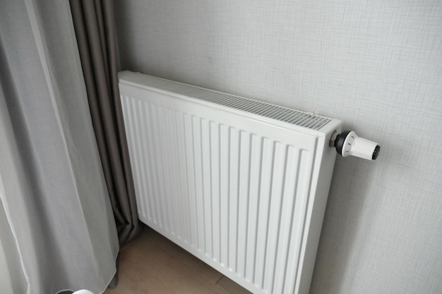 Heating radiator under window in the room